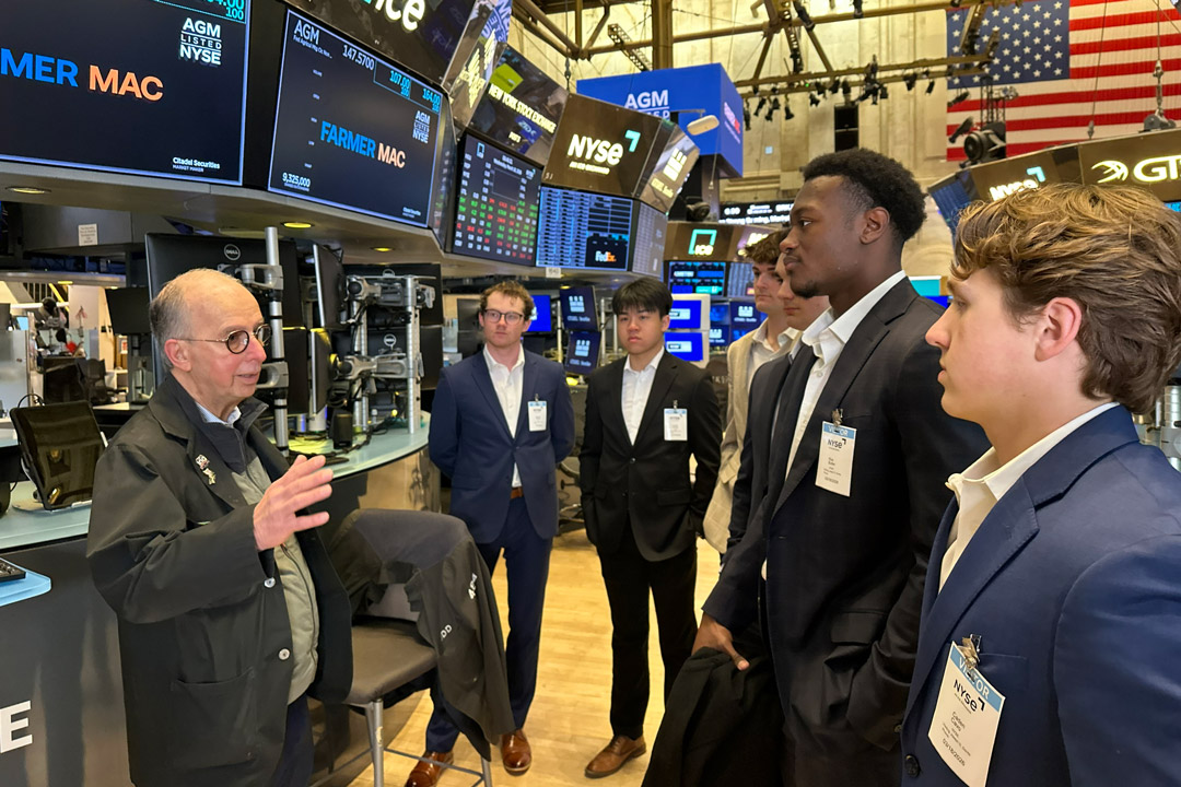 Members of RIT's Financial Management Association visit the New York Stock Exchange during a trip to New York City
