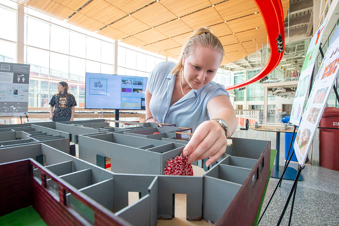 Kayla Barrett, pictured, and her teammate Bayleigh Thurston designed the “office of the future” for their client, Rochester Regional Health. The students used the SHED’s facilities to 3D print components of the prototype. 