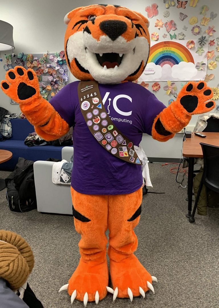 R I T mascot tiger ritchie is shown ina colorful room
