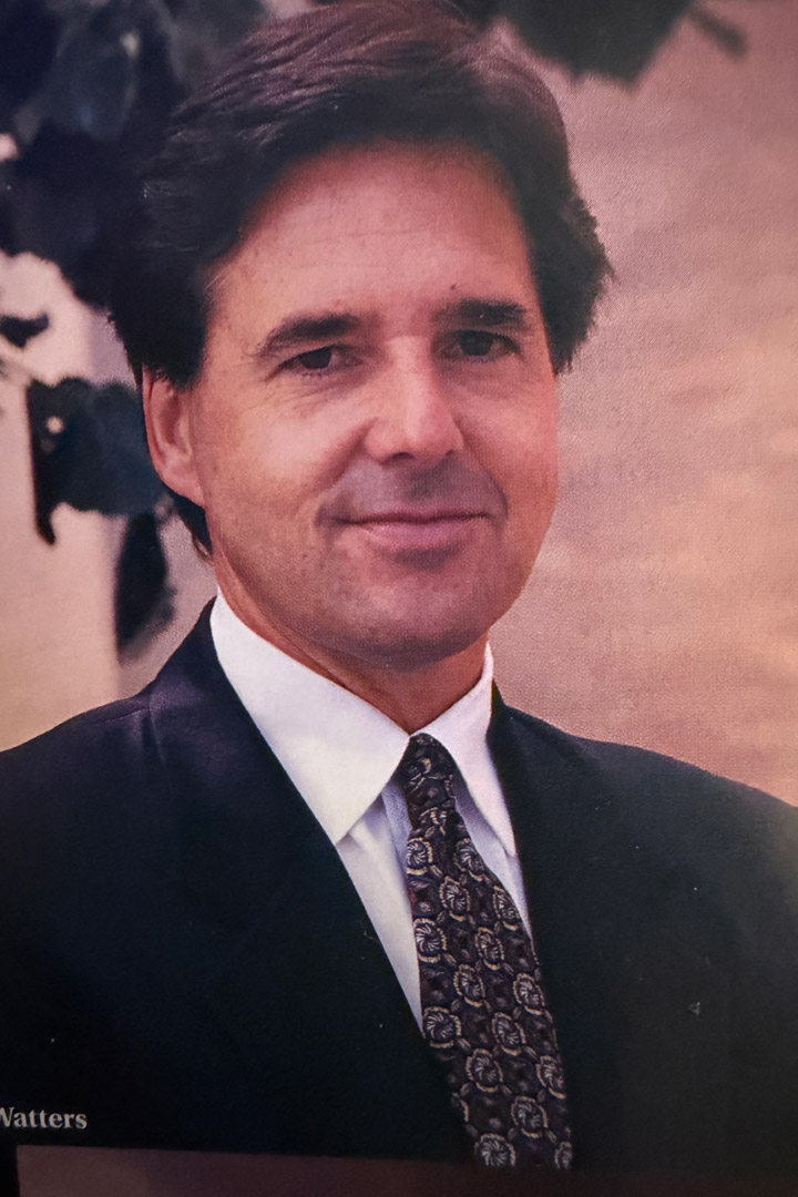 Headshot of a man in a suit and tie