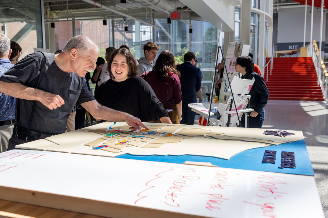 people of various ages view a presentation