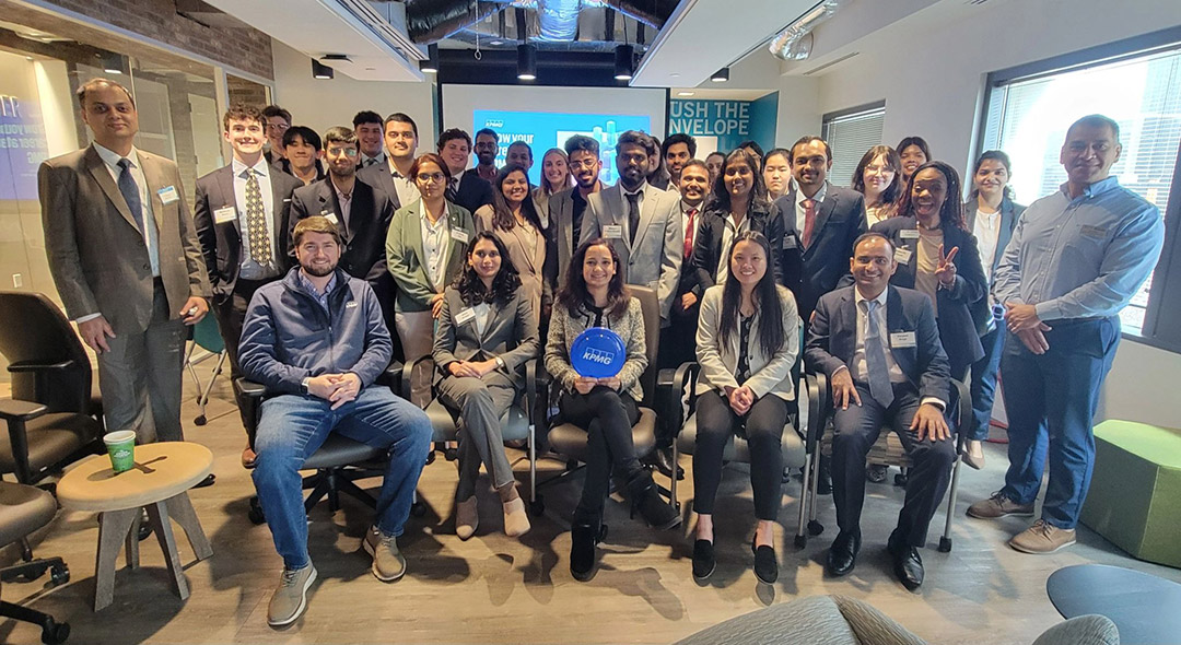 a large group of students and mentors gather for a photo.