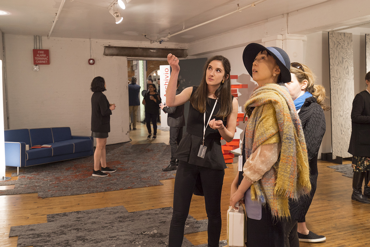 Samantha O'Neill interacts with an exhibit visitor.