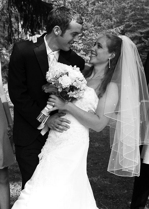 Groom holding bride.