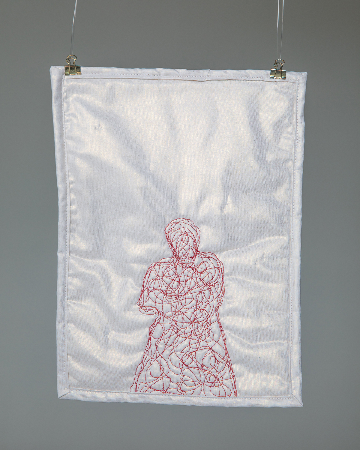 A photo of an embroidered piece of material. 