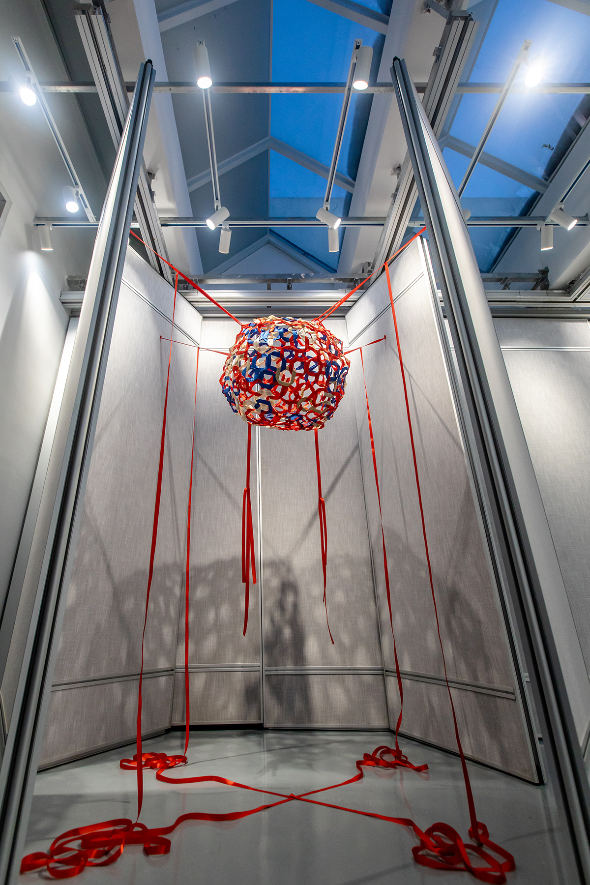 A large sculpture installation made of ribbon and steel wire.