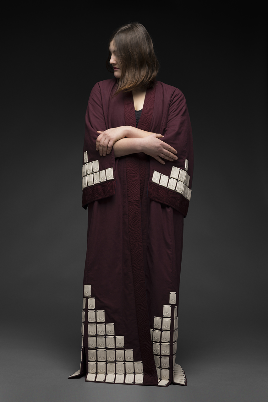 A robe designed by Zara Davis. his is a visual example of Zara Davis exploring ceramics and culture through feminism art.