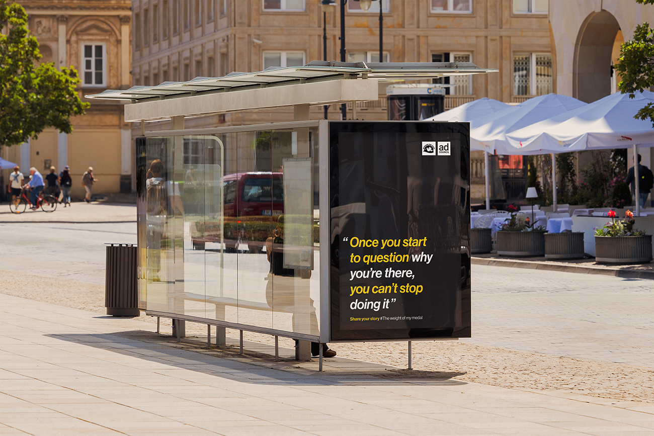 A bus stop containing a graphic as part of an ad campaign.