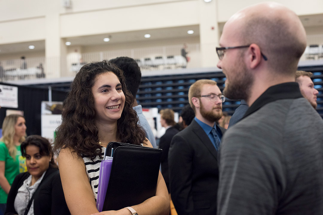 Student talks to recruiter.