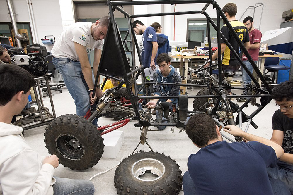 Students work on baja car.