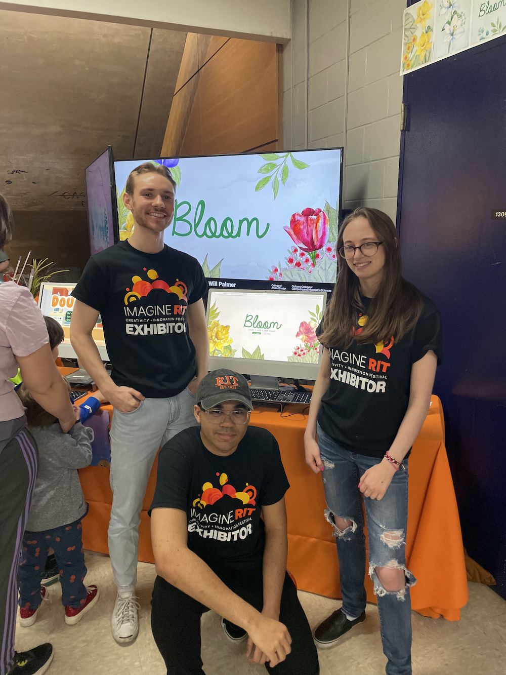 Bloom team in front of their exhibit at Imagine 2023