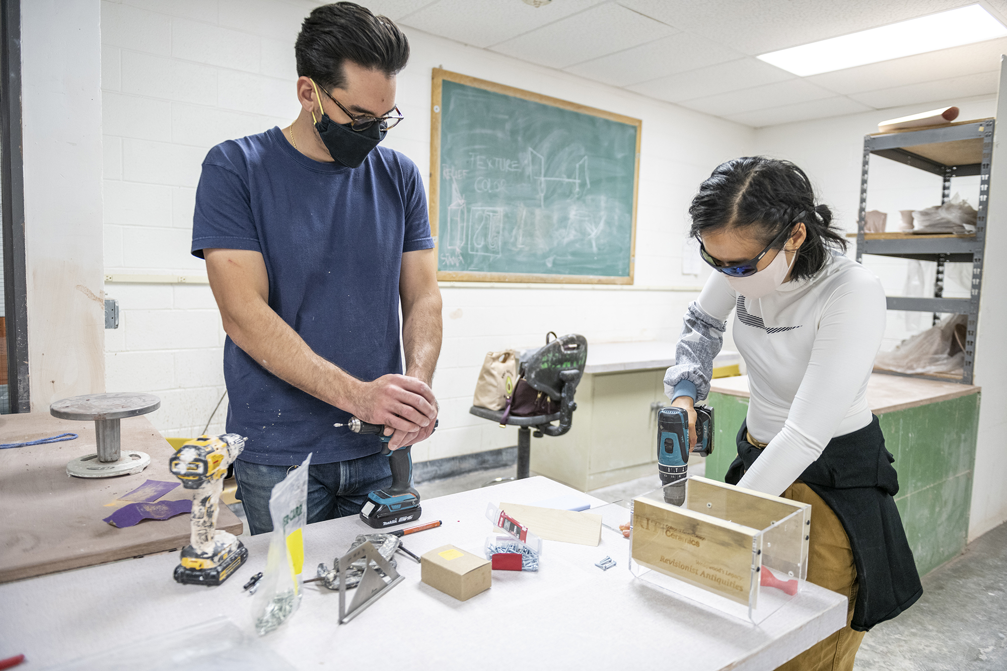 Fabianno Sarra supervises a student putting together a mold system.