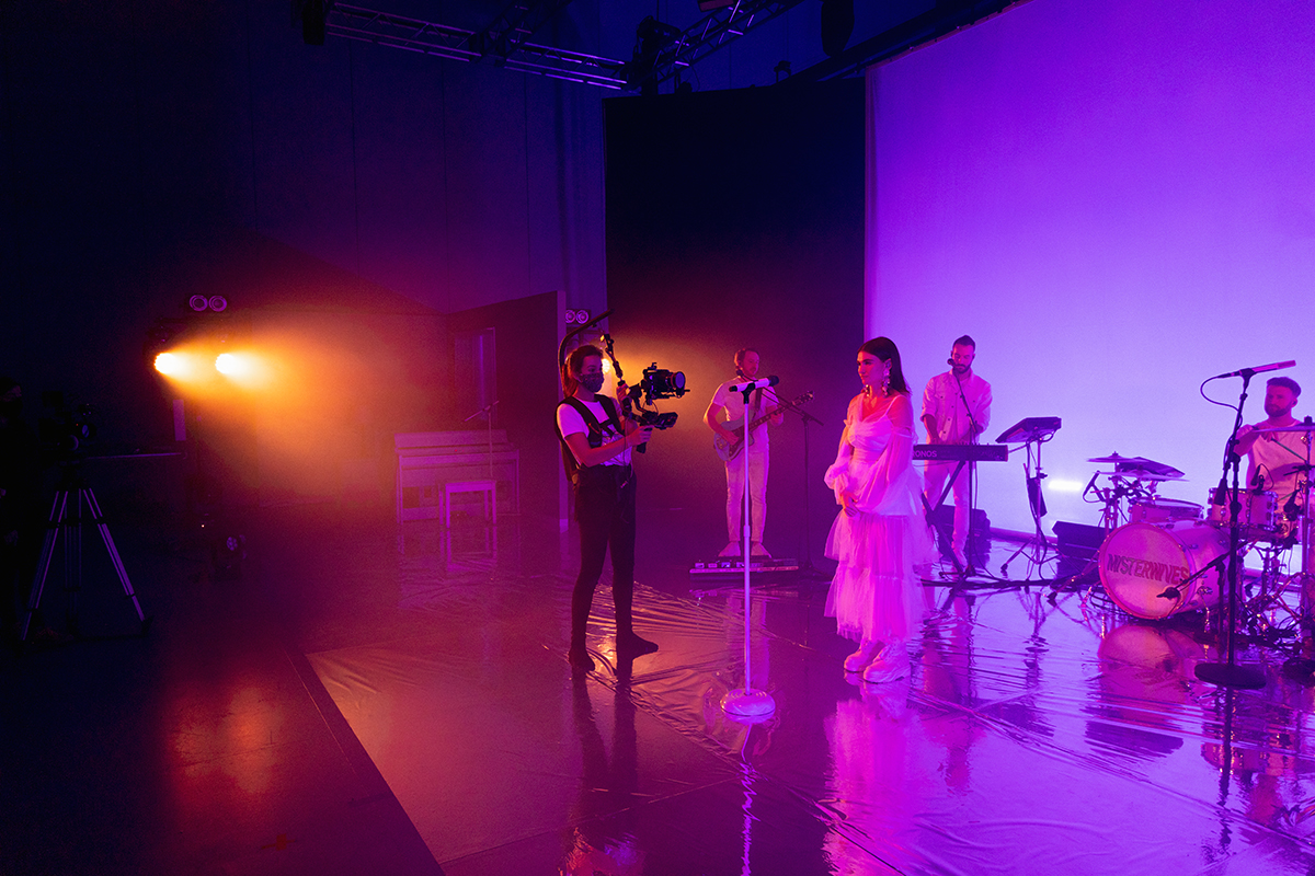 Main camera operator Carrie Stalk films MisterWives while it performs.