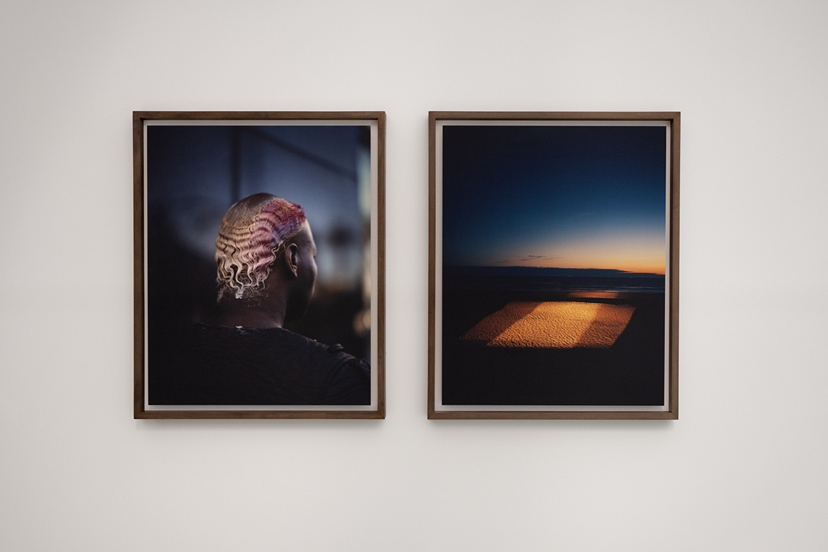 Side-by-side photos on a gallery wall.