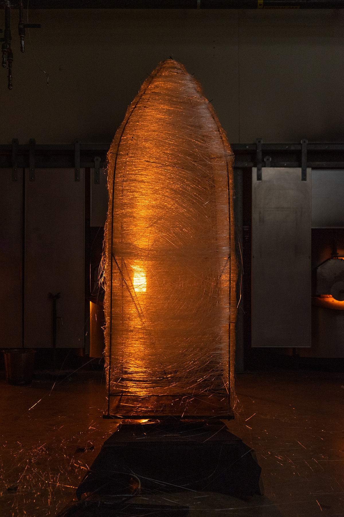 A large, woven glass sculpture.