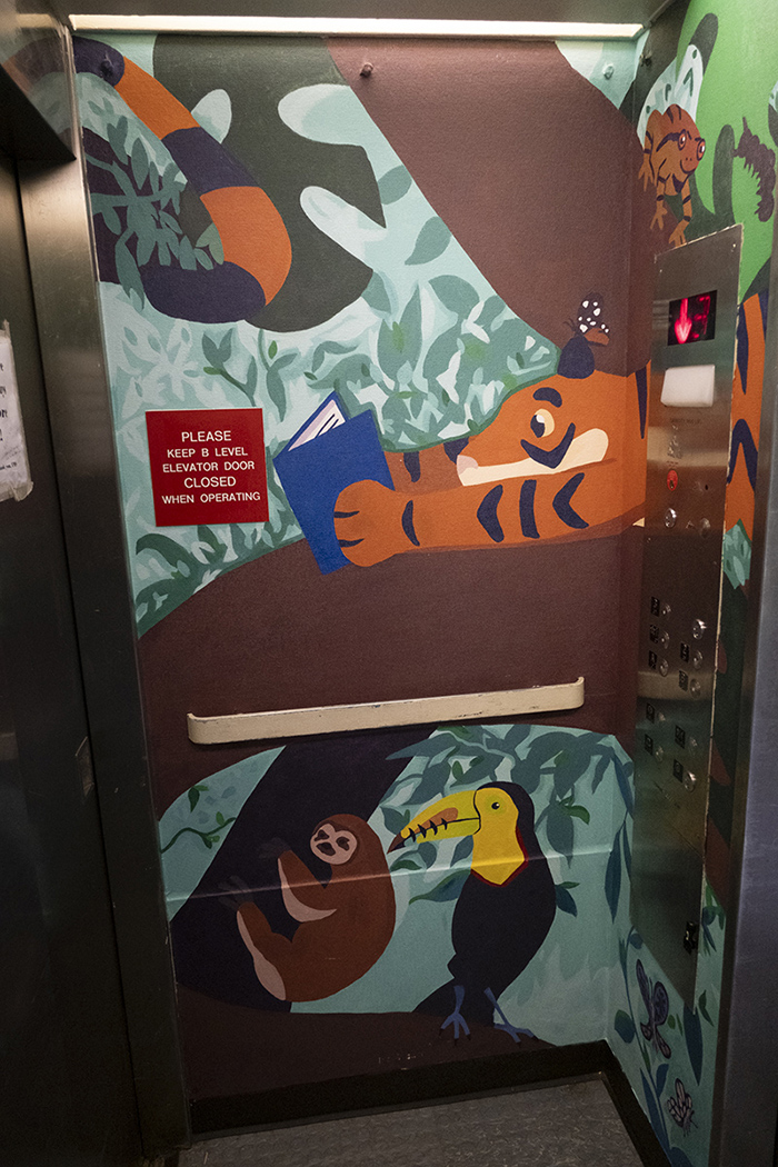 A tiger-themed elevator mural.