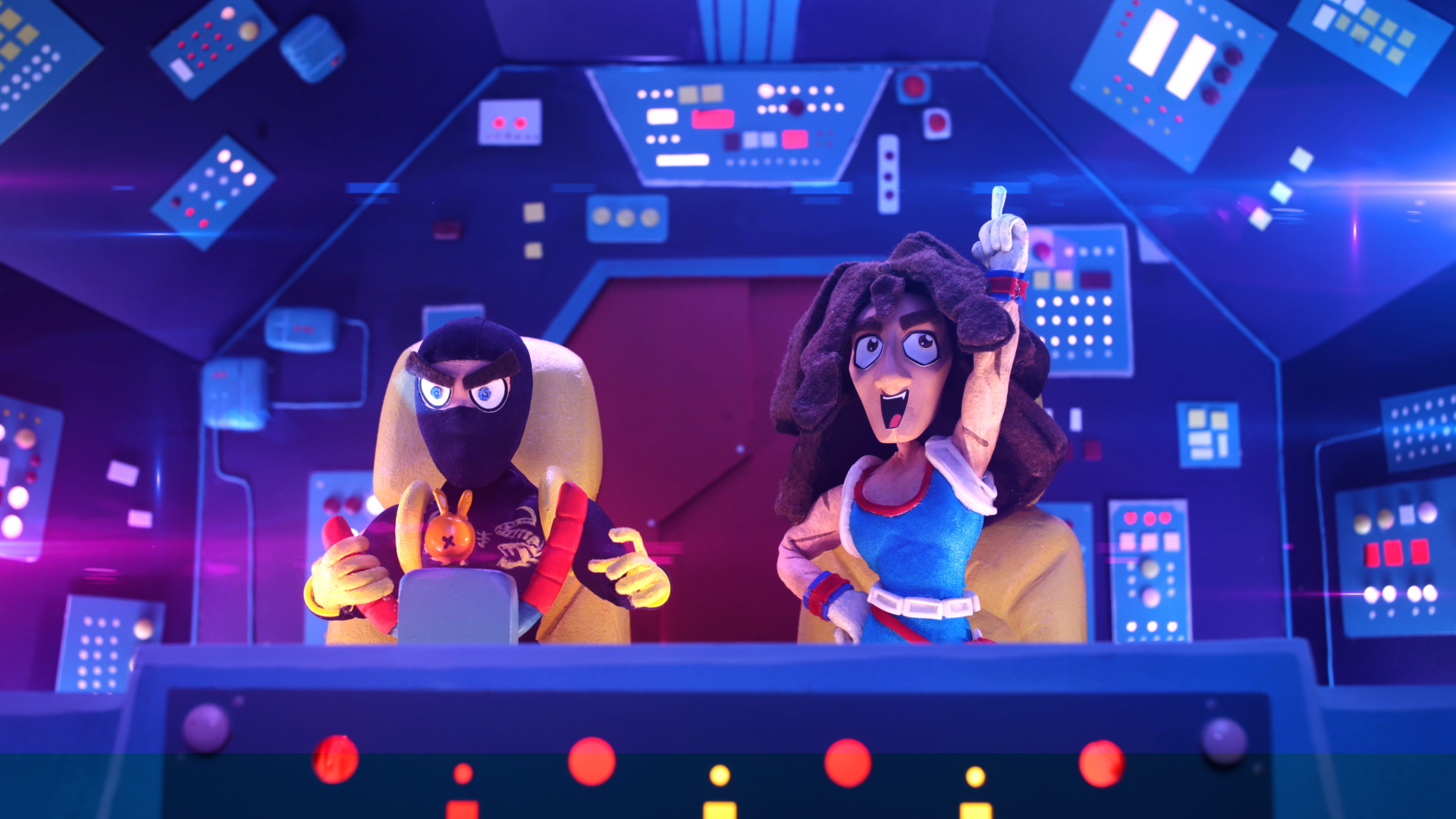 Two stop motion animated characters sit in a spaceship cockpit.