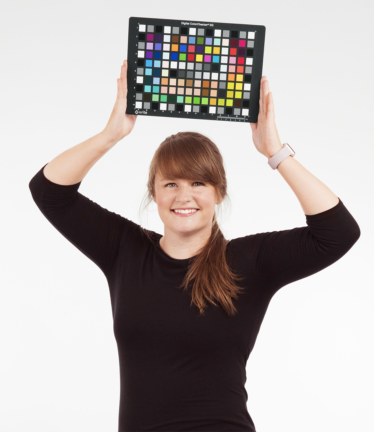 Jaclyn Pytlarz holds up a color checker.