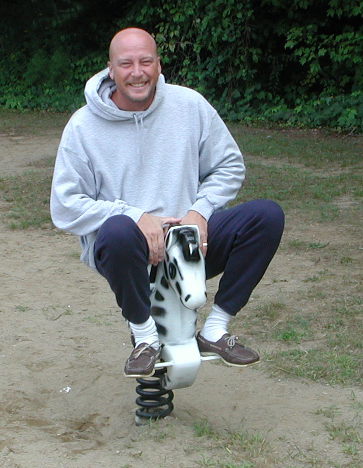 David Walter on a playground toy.