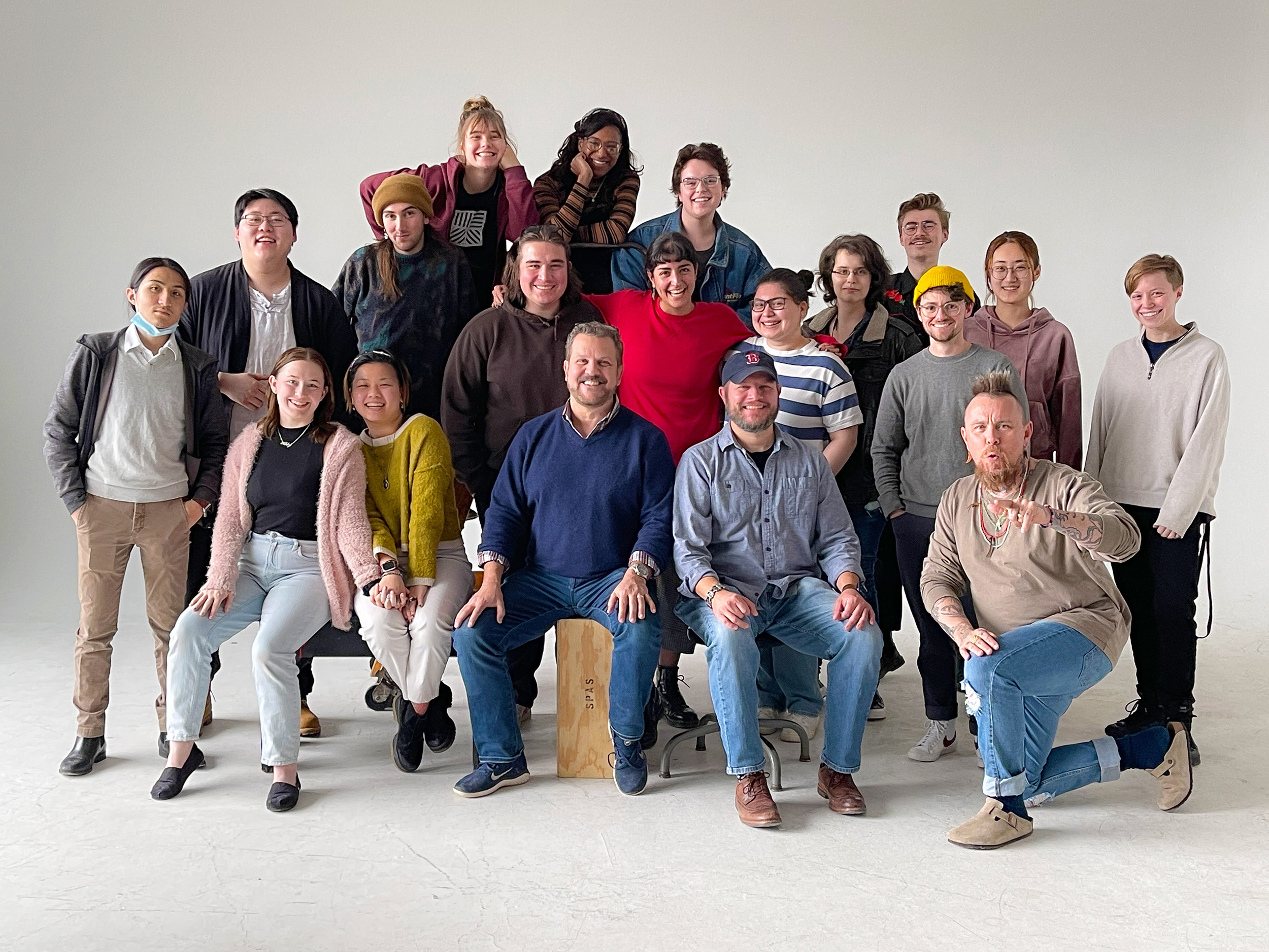 A group portrait taken in a photo studio.