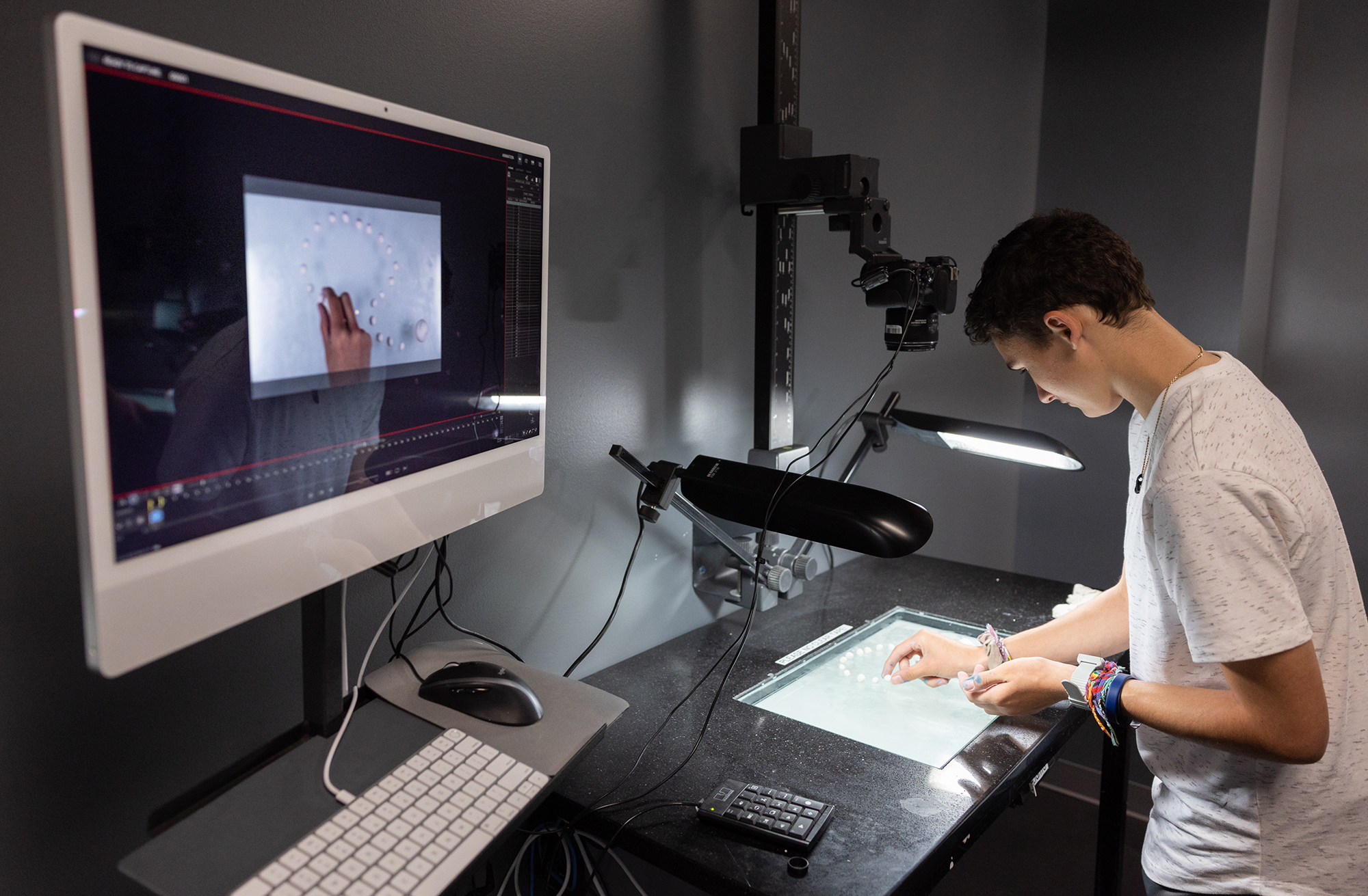 A downshooter setup with a computer, lights, and camera.