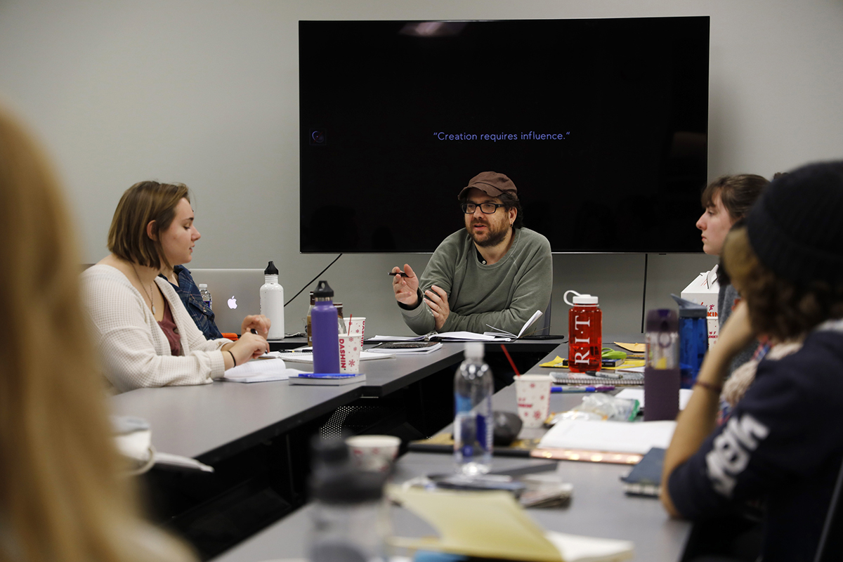 Eric Maierson leads a workshop for a group of photojournalism students