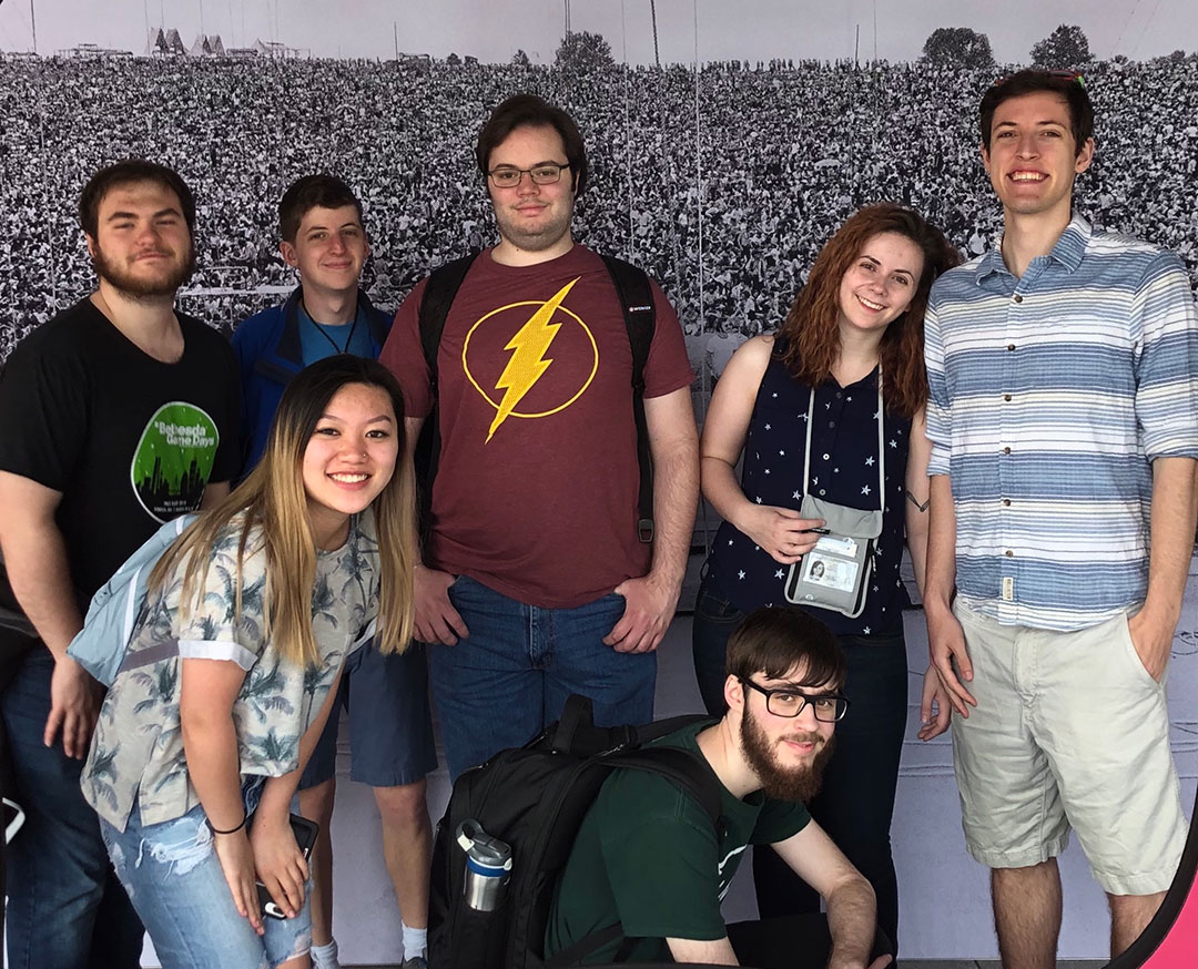 Group of seven students poses for photo.