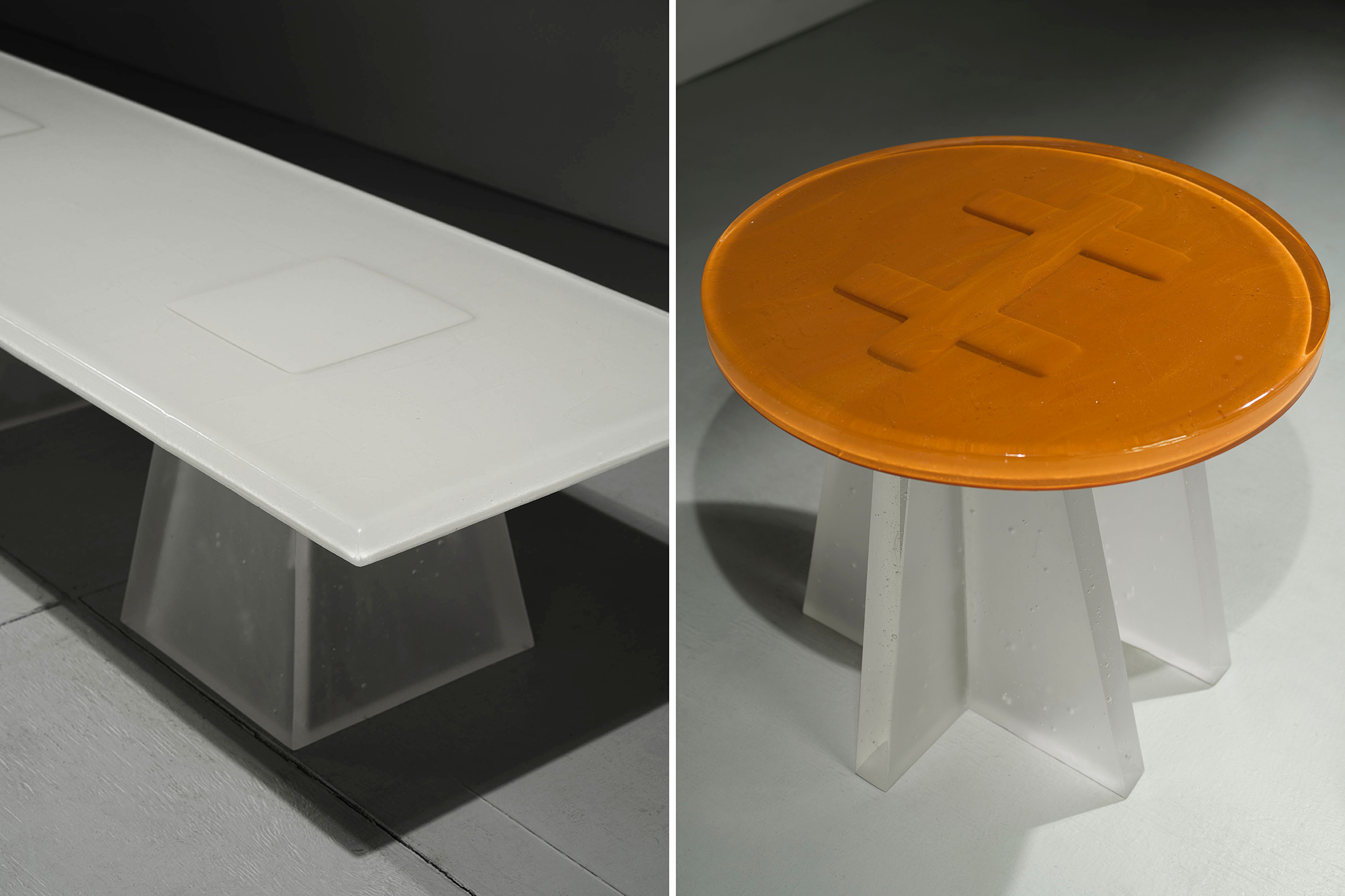 A side-by-side of cast glass tables — one a coffee table, the other a side table.