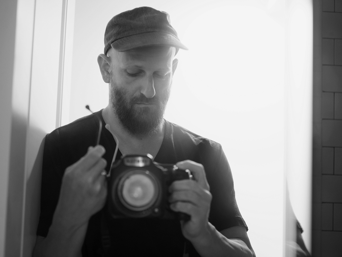 Greg Halpern taking a photo of himself in the mirror.