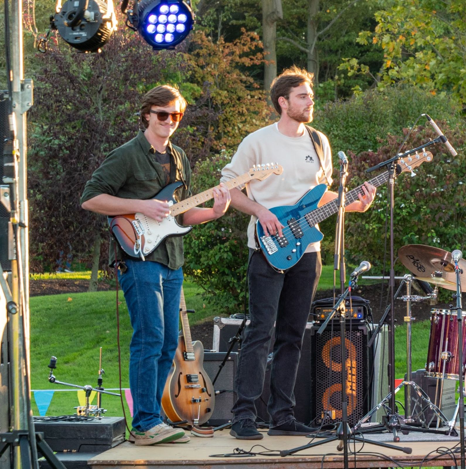 Colin O'Brien plays guitar with another person.