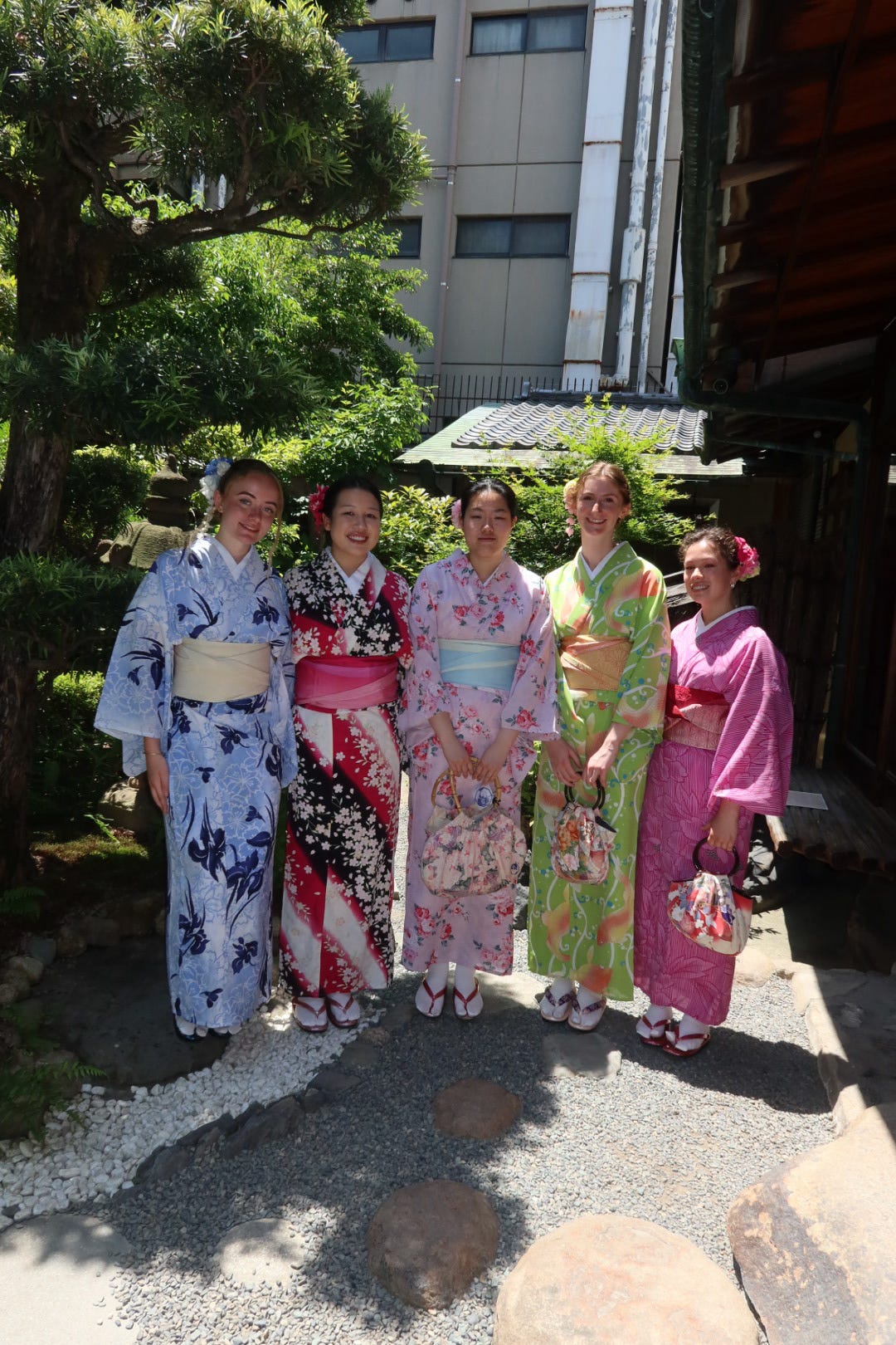 Five students dressed in kimonos.