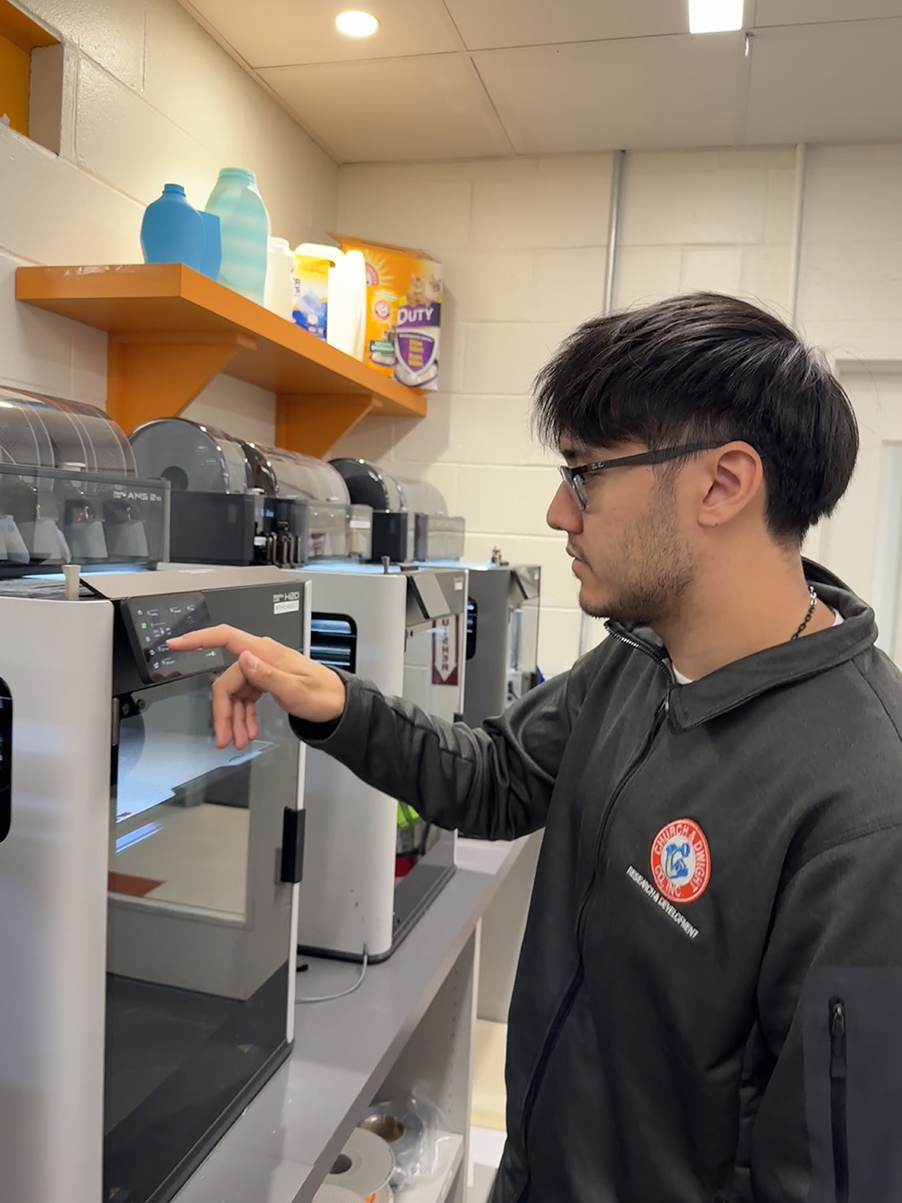Gavin Komoda operates 3D printers.