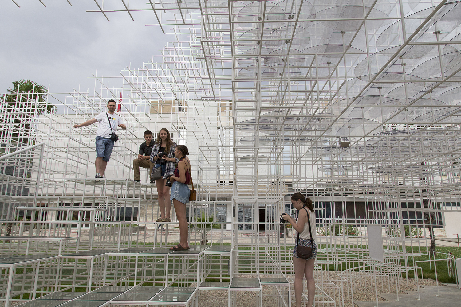 Students pose on a weird structure