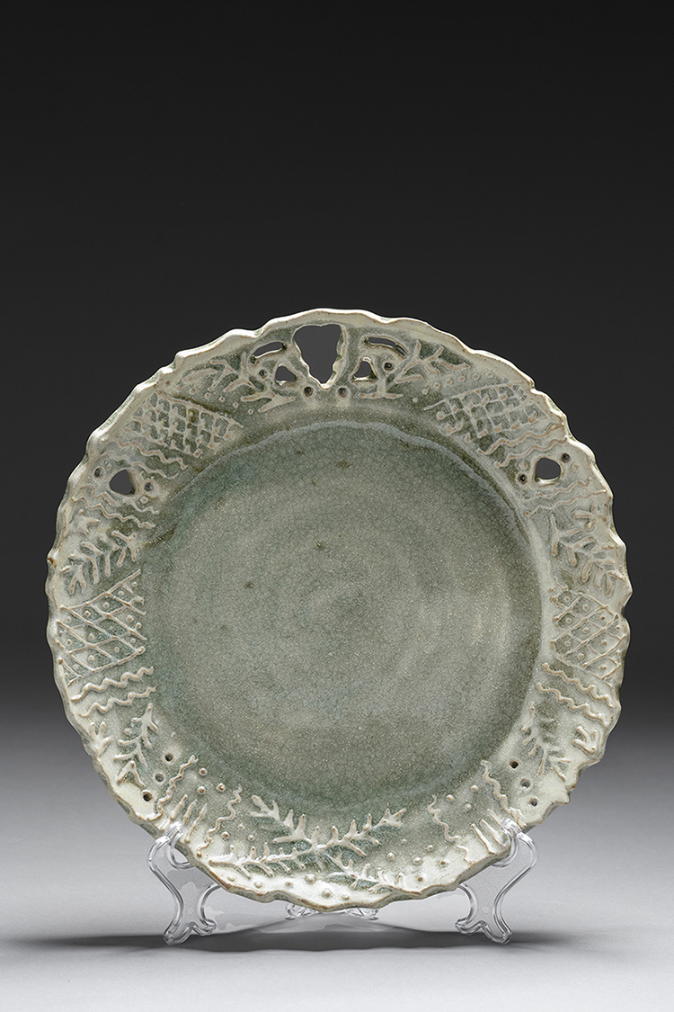 A studio photograph of a ceramic plate by Emma Herz Thakur.