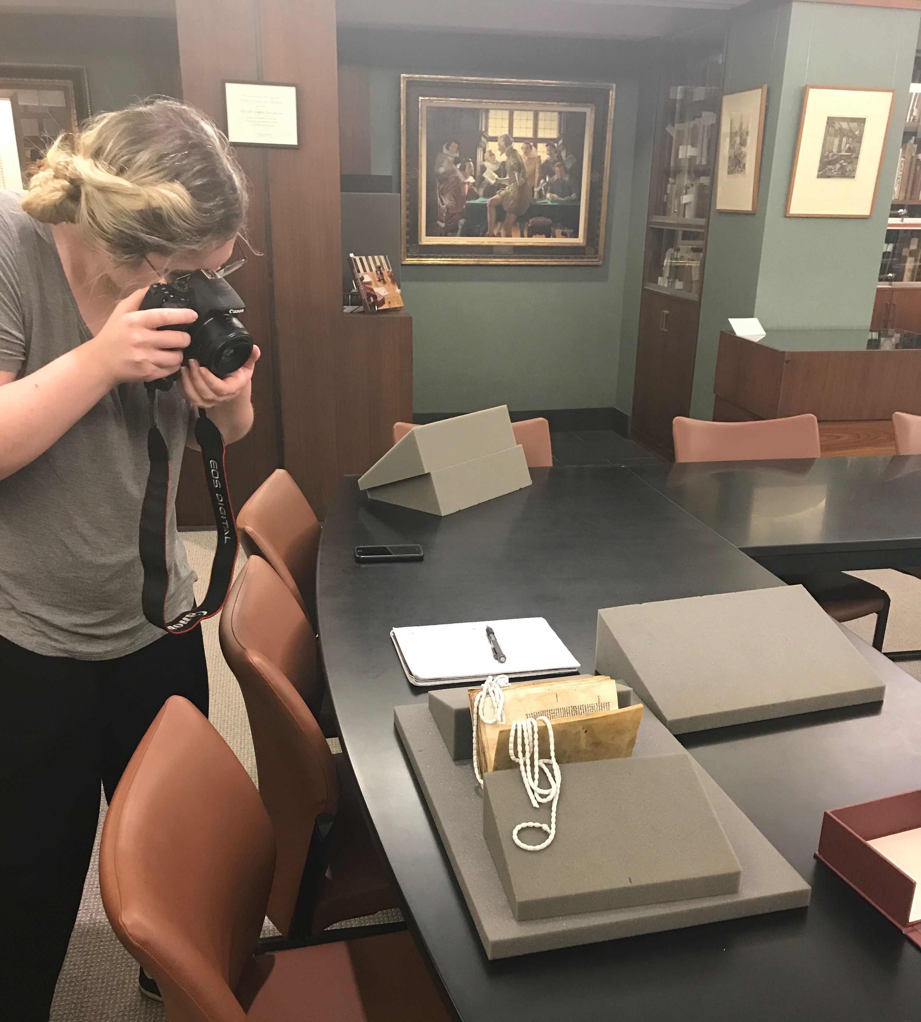 Student takes photo of book