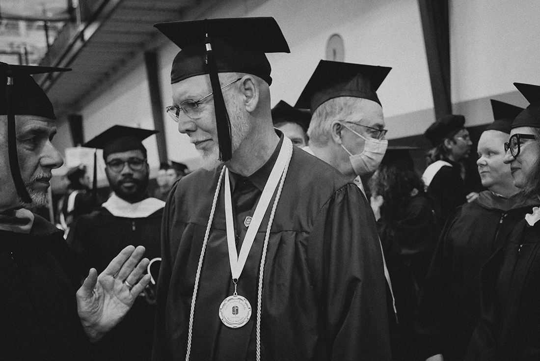 David Turner wears a medallion at commencement.