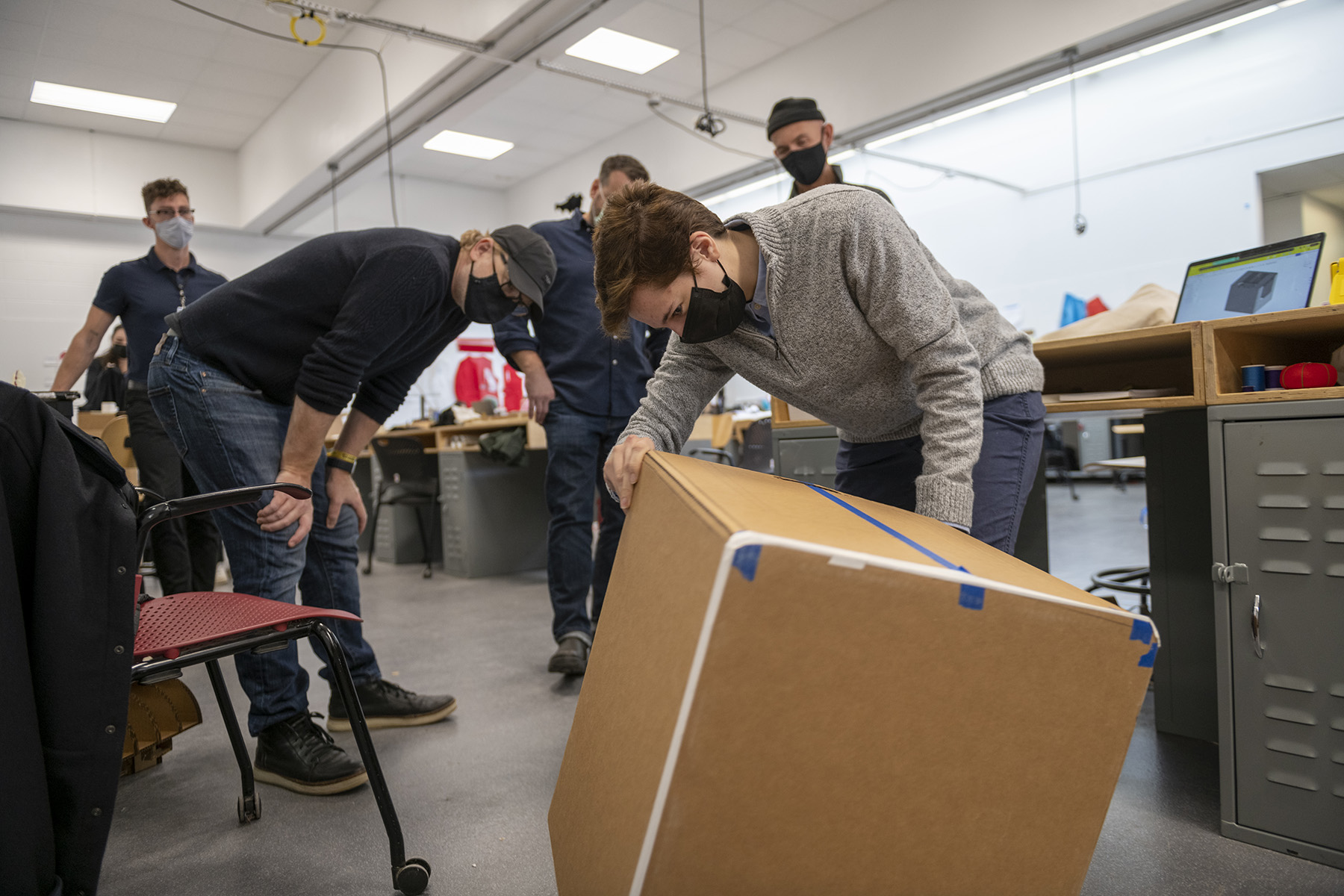 Ari McMahon shows off her cat litter box prototype.