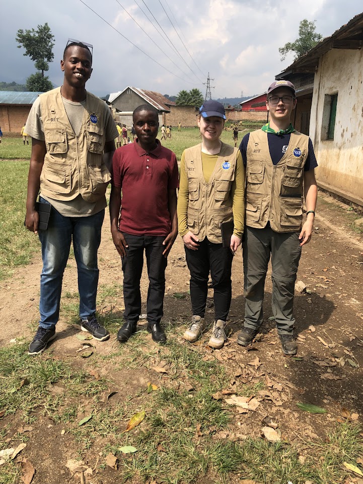 four people standing