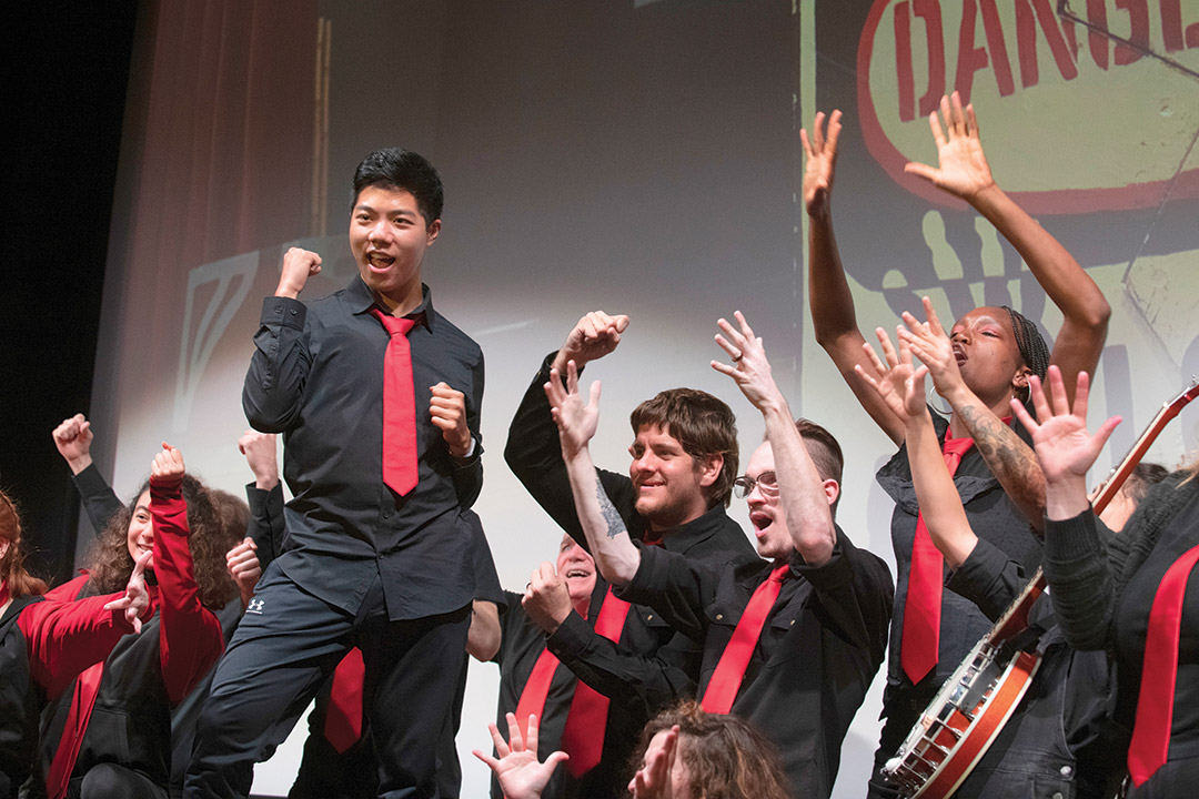 group singing and performing in sign language.