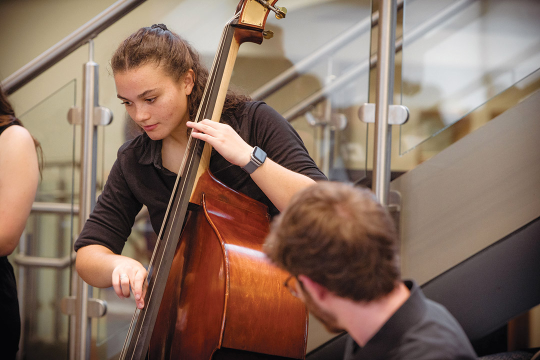 college student playing the double bass.