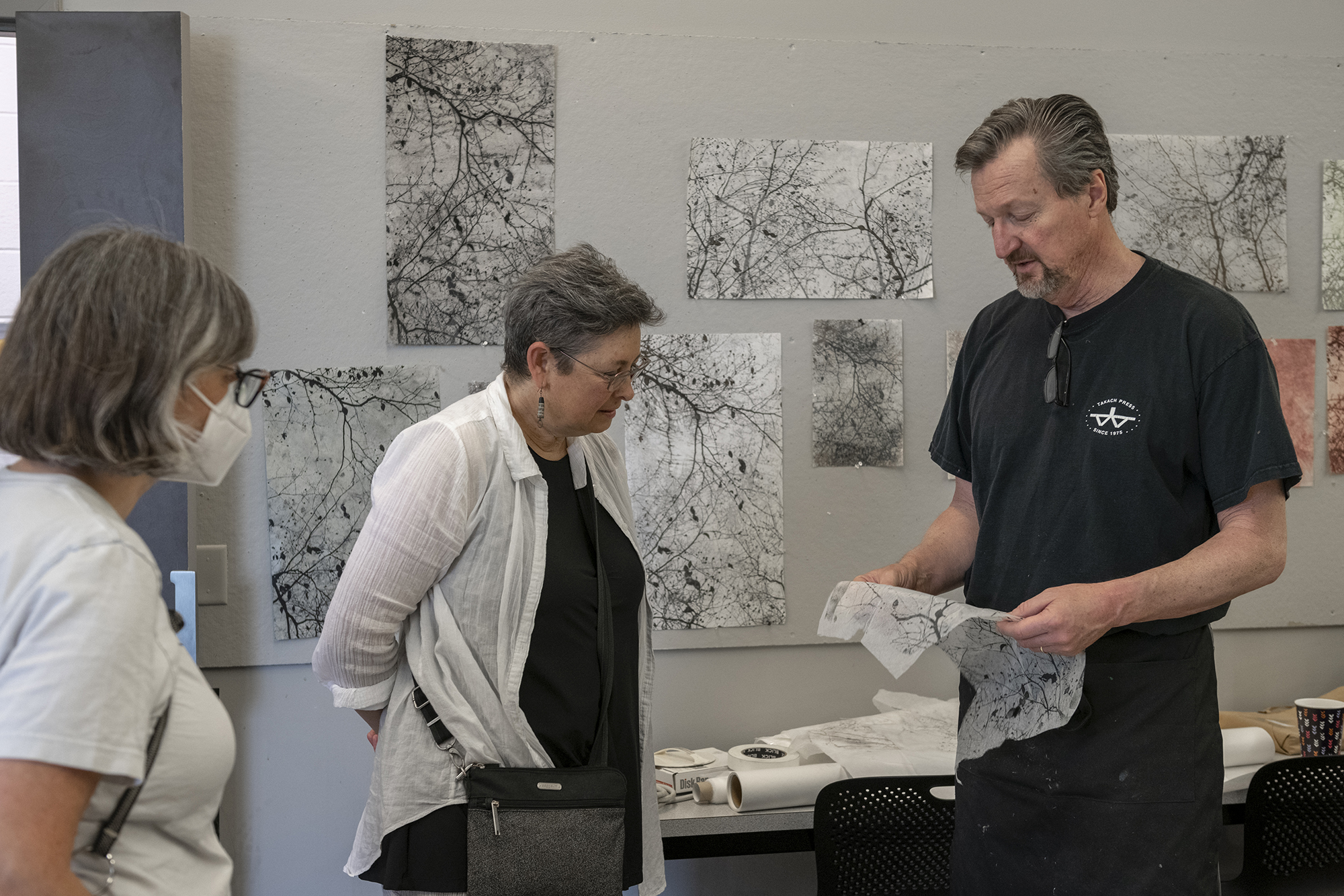 Bob Erickson shows off his prints during open studio hours.