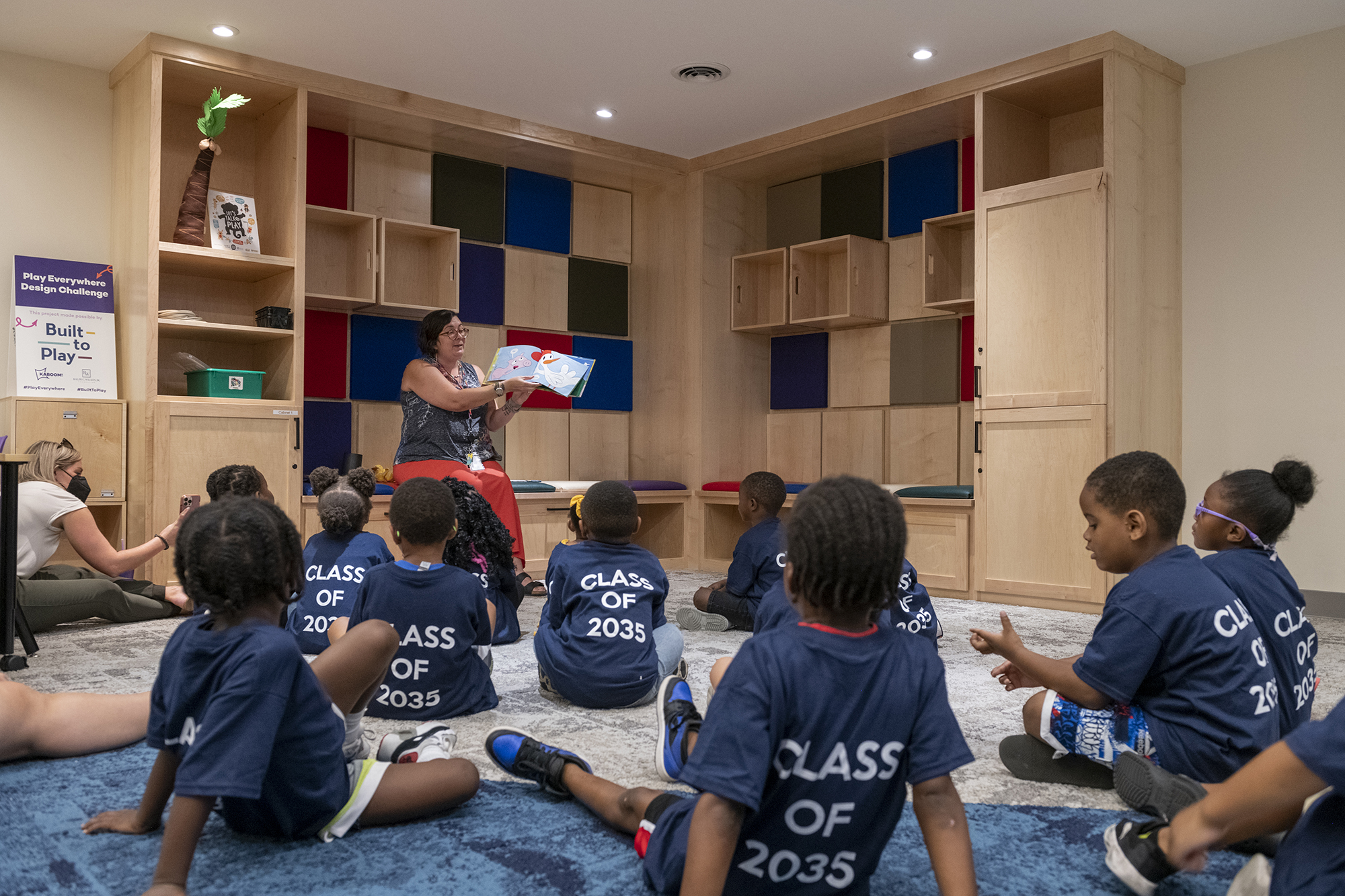 Children gather in the Secret Room for story time.