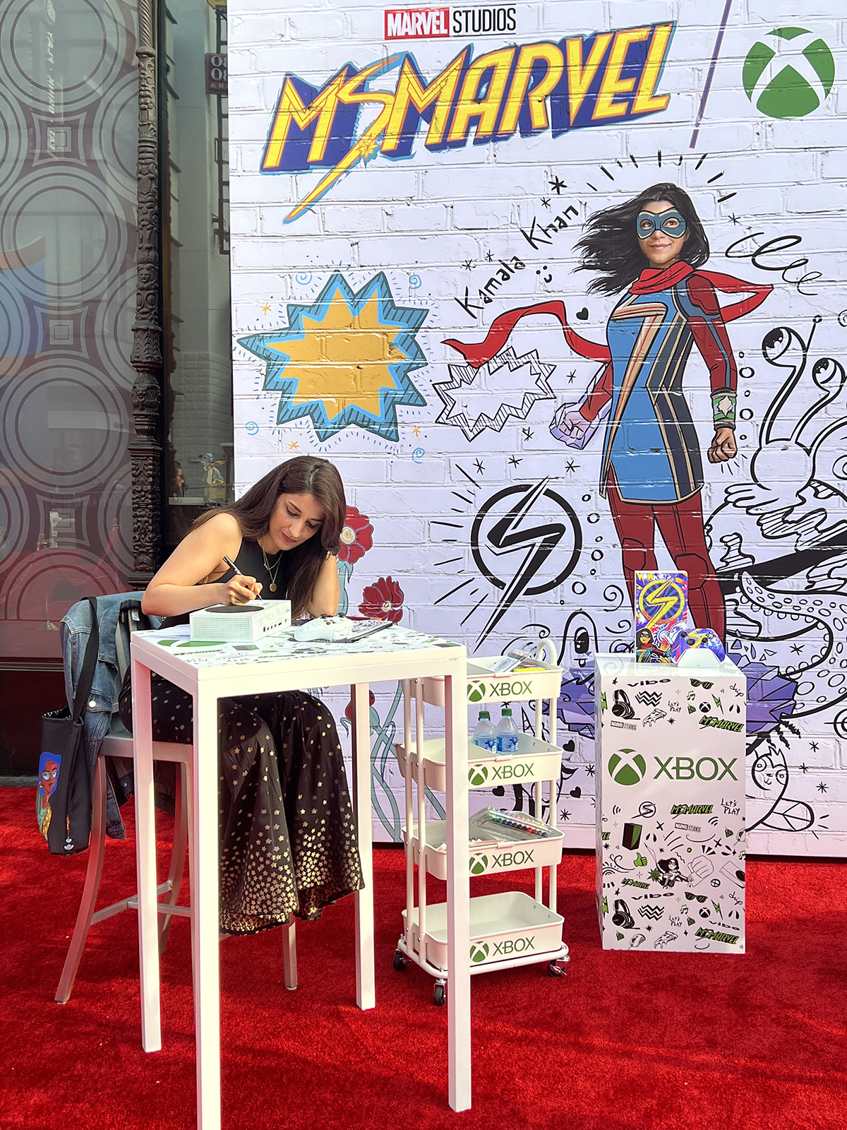 Shehzil Malik draws on an Xbox at the Ms. Marvel premiere.