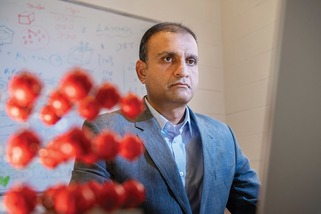 professor standing in front of whiteboard.