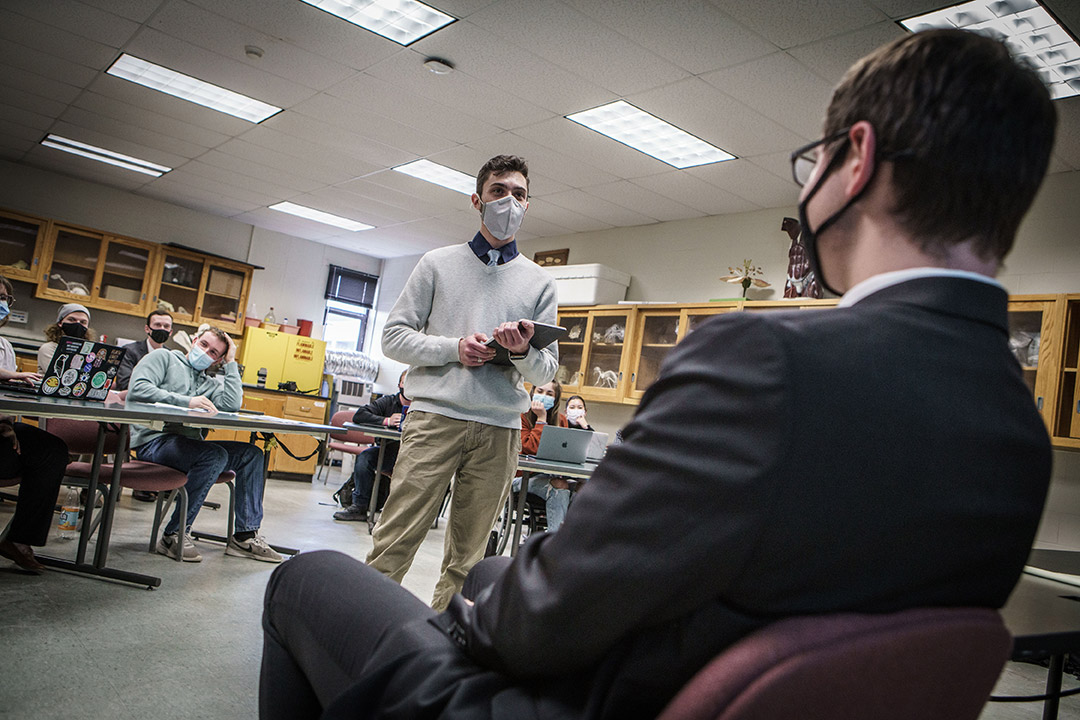 student being questioned by another student in a mock trial.