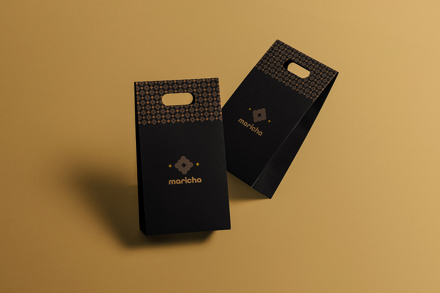 Branded coffee bags in black and gold.