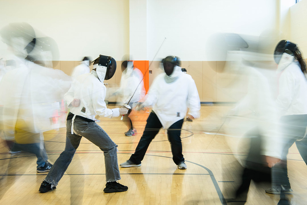 Students fencing.