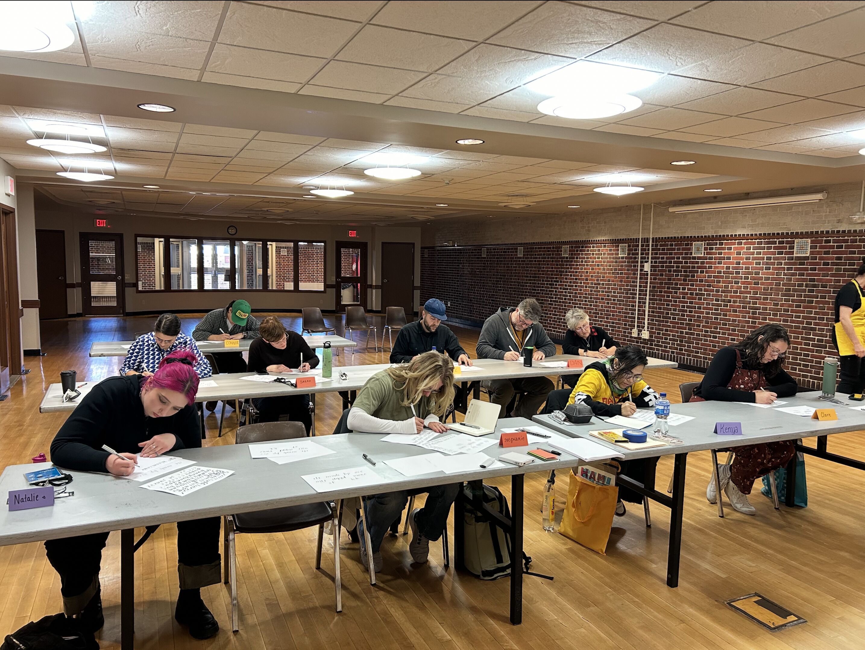 Participants trying out calligraphy