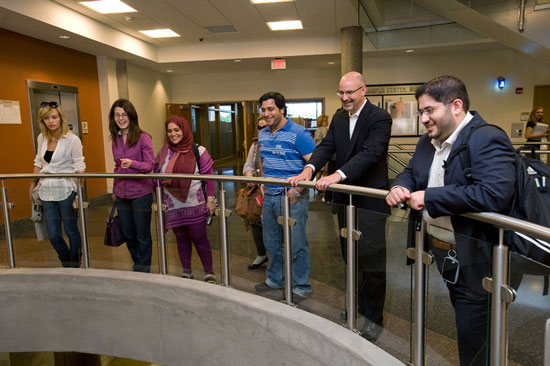 Professors looking at fountain