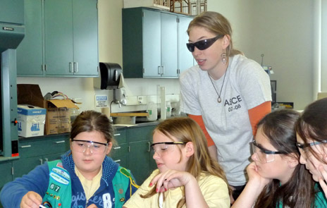 Girl scouts working on experiment